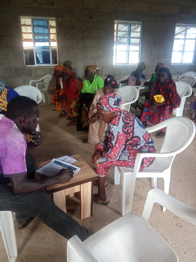 Elderly women registering at the community palace