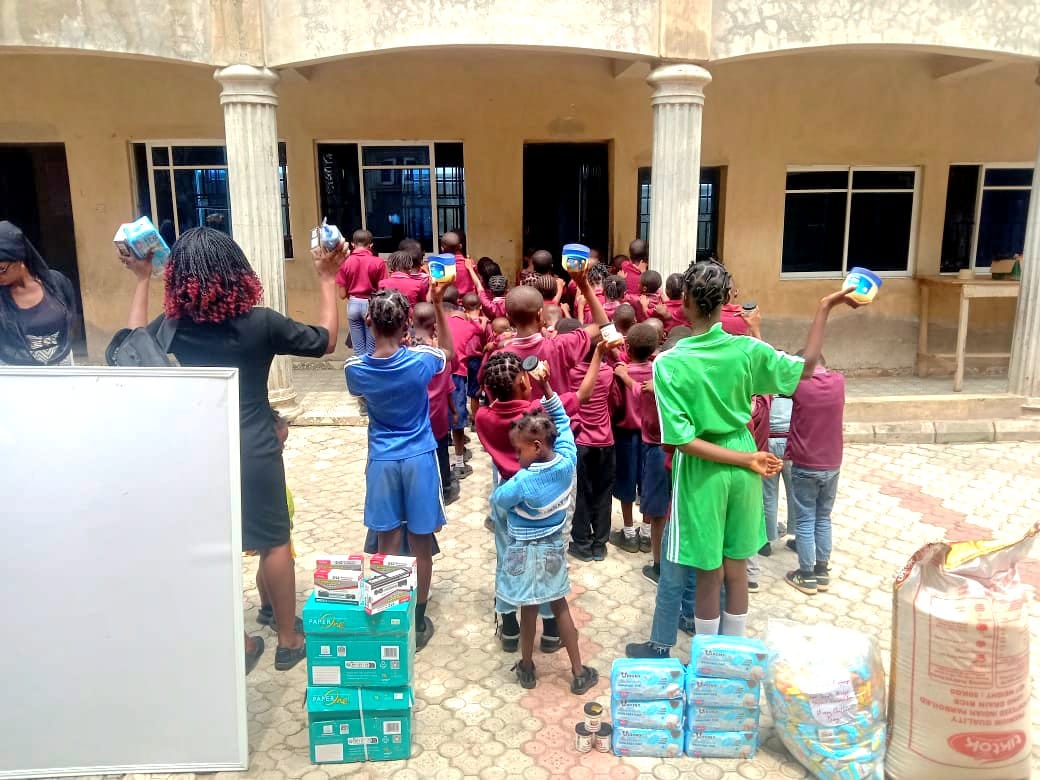 The children of God's Mercy Orphanage with the donated items